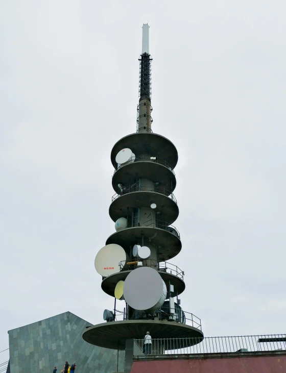 a clock tower is located next to a building