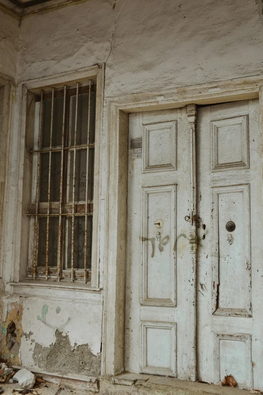 two dirty doors in an old run down house