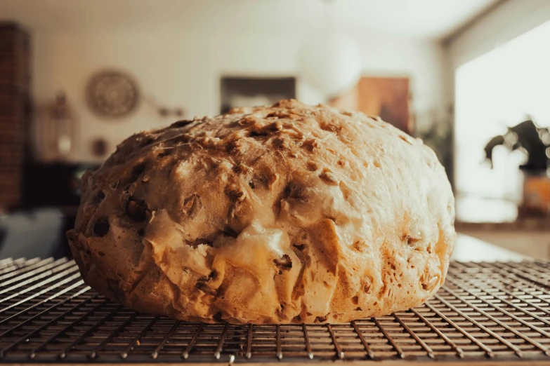 a large loaf of bread on top of a wire rack