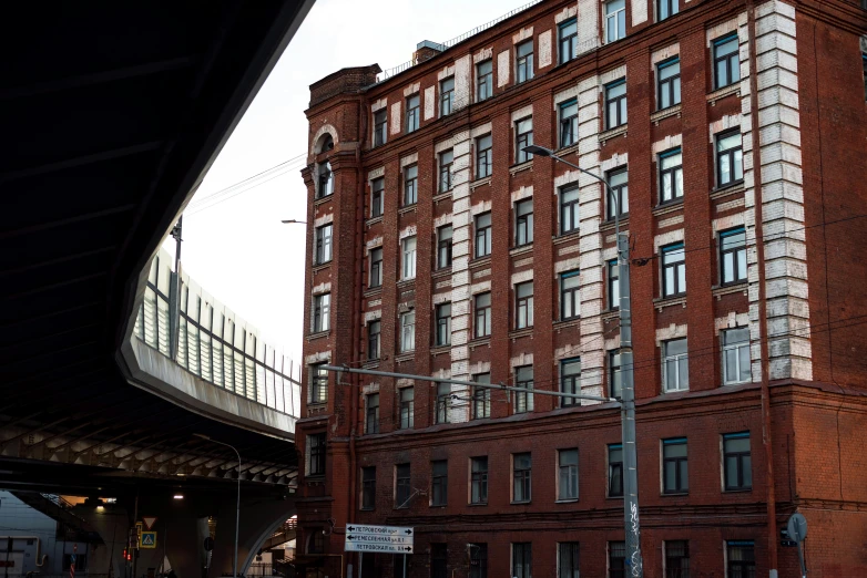 a big building with a bridge above it