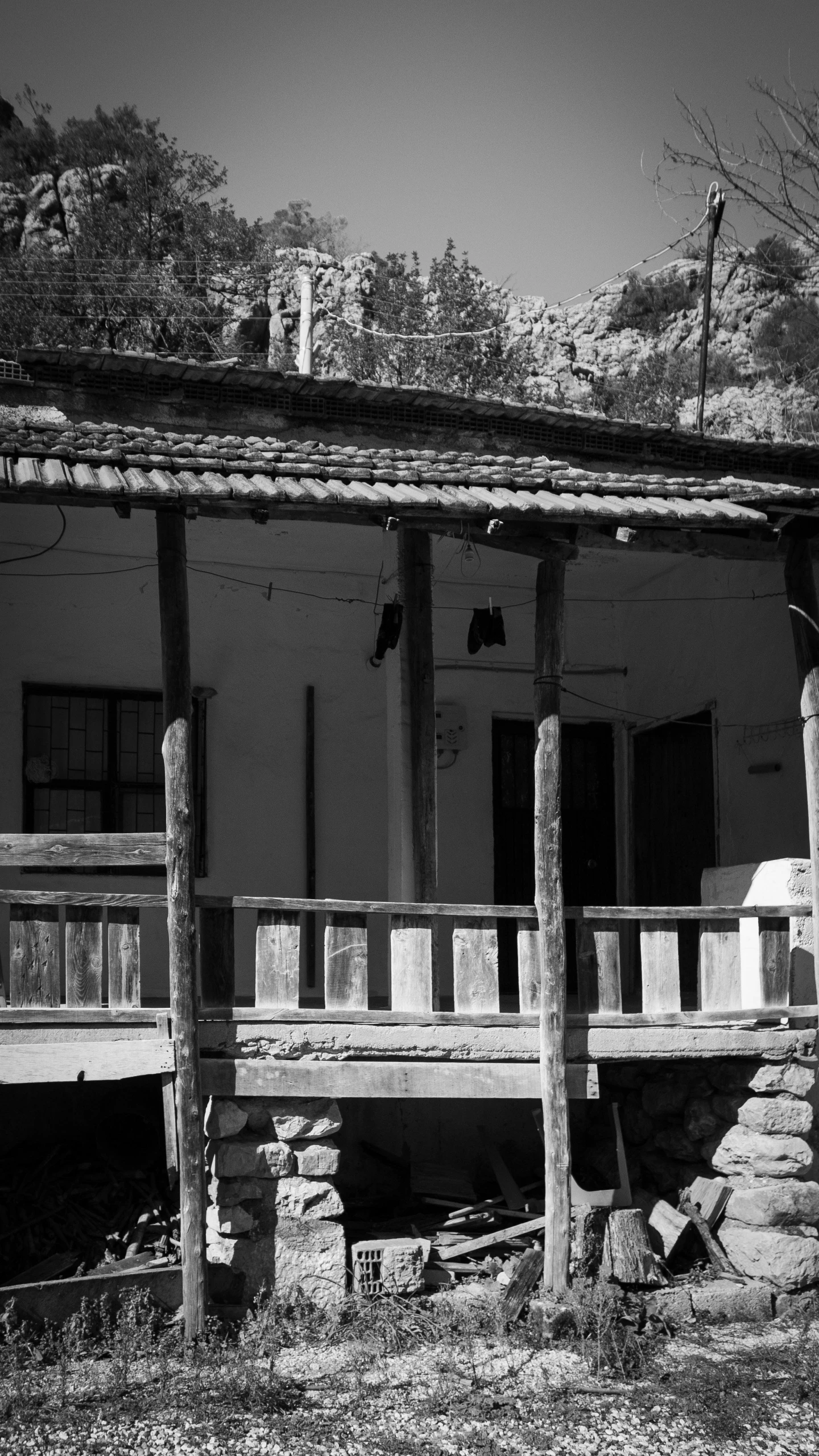 a black and white picture of a stone house