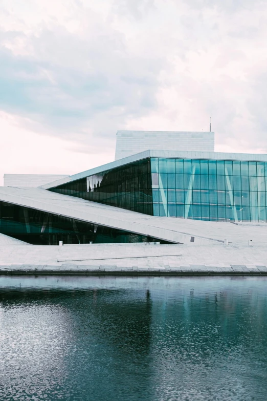 a large building with a unique green exterior