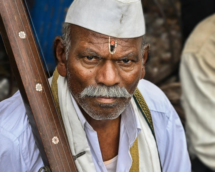 a man that has a beard and hat