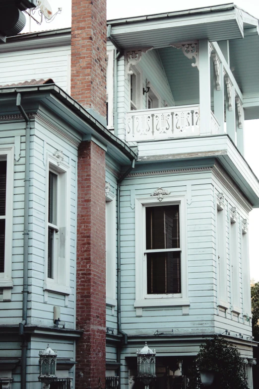 an old white house with a tall white clock tower