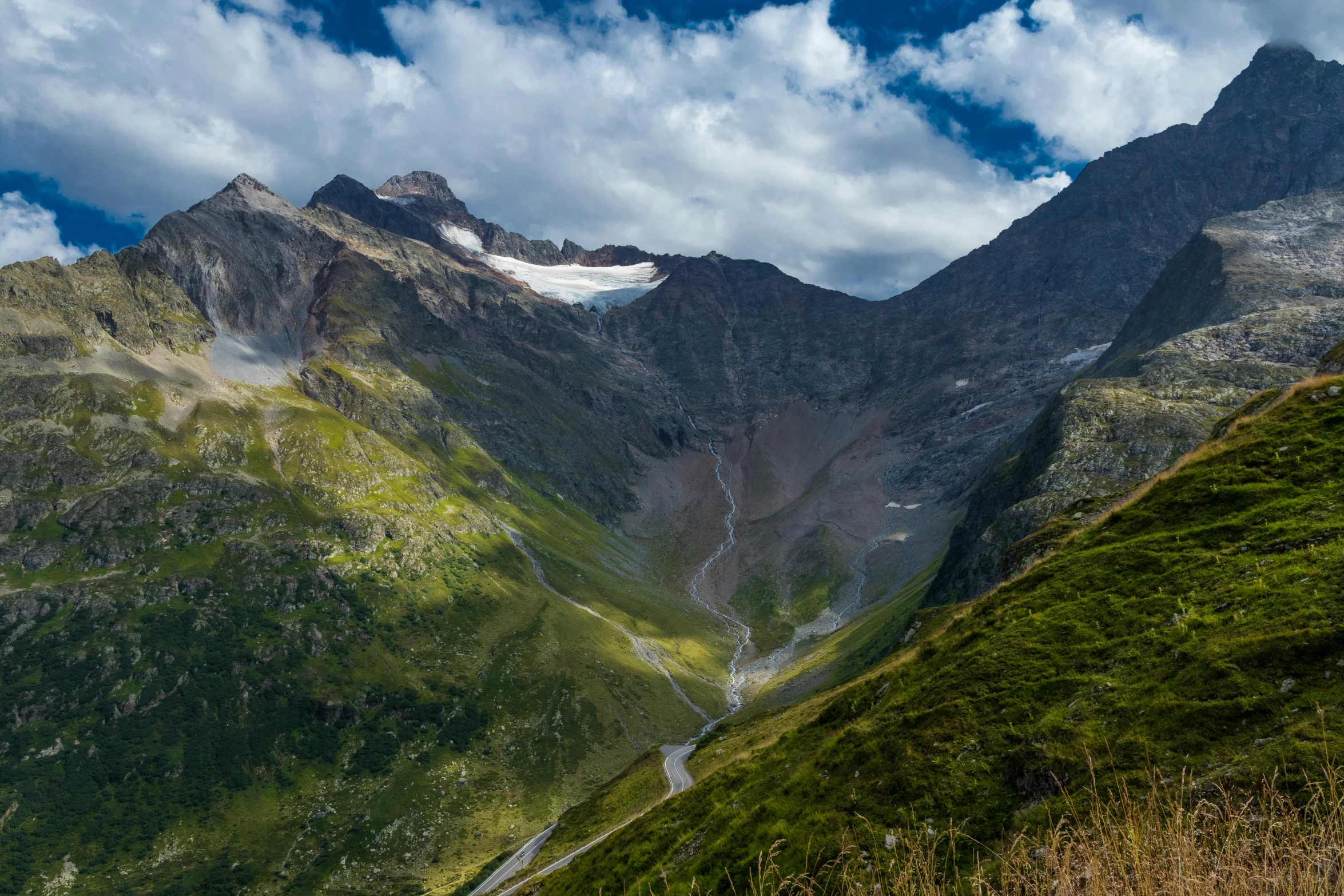 some hills and streams are shown with a sky background