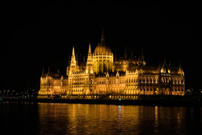 a castle building with lighted up in the night