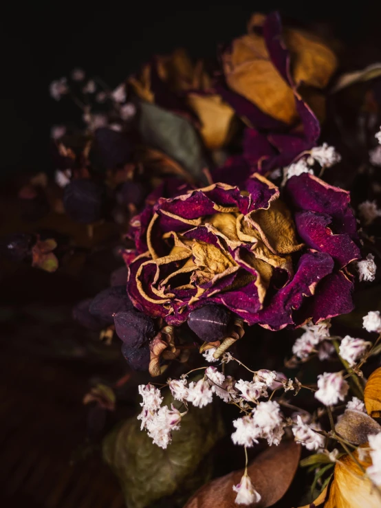 the dried flowers are sitting in a vase