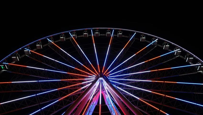 the big wheel is lit up and ready for the rides