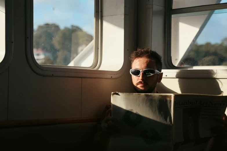 a man reading a book in a boat or boat