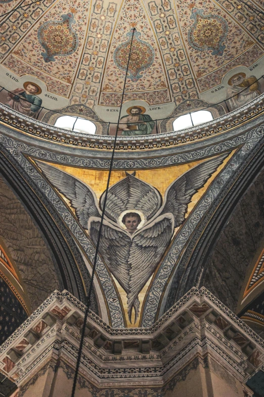 the interior of a dome that has a mosaic and other things in it