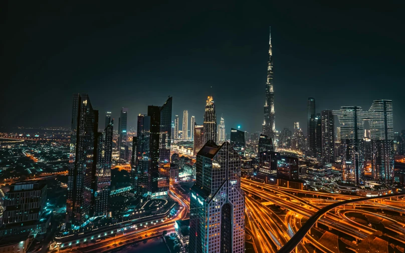 a city at night with many different buildings