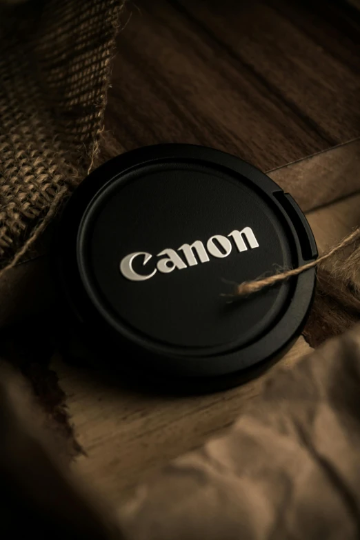 a picture of a bottle cap with a lid labeled canon