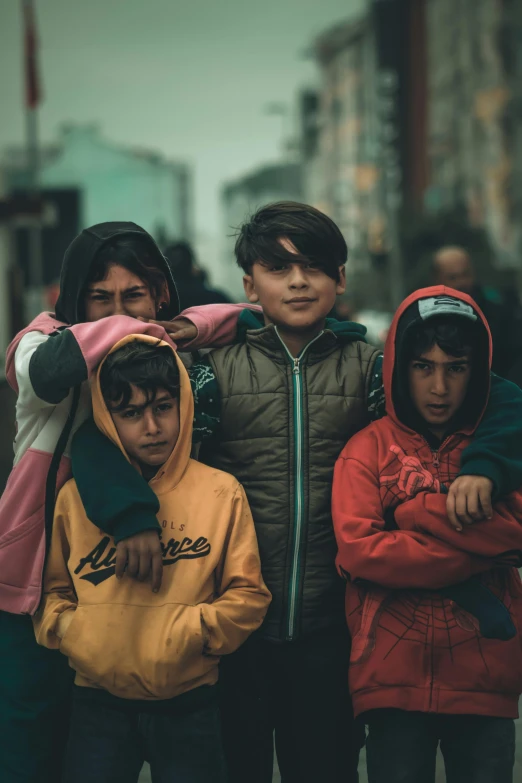 a group of children with their arms around each other