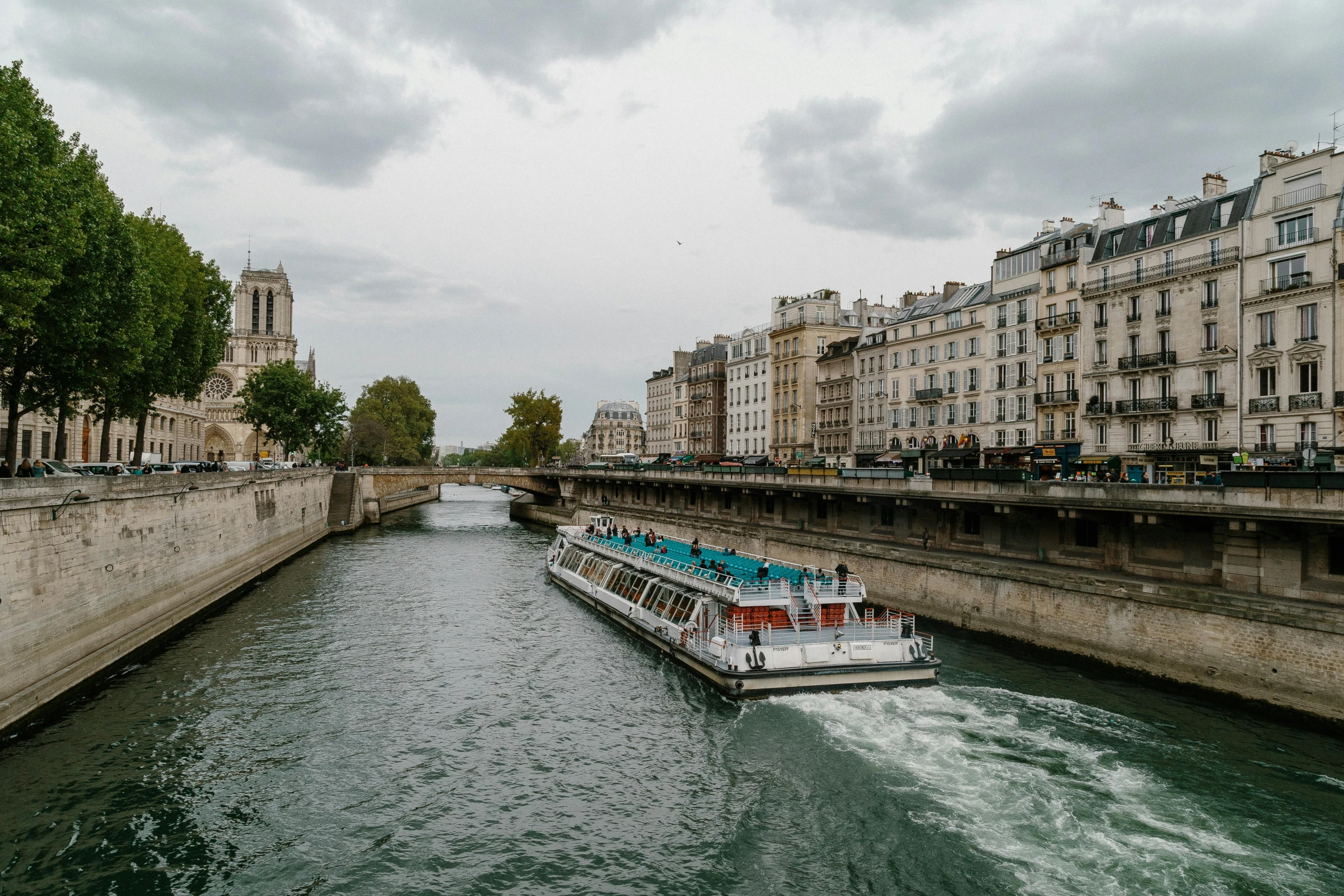 two boats floating down the river in paris