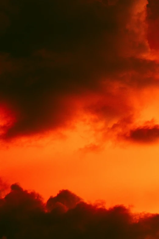 an airplane in the sky at sunset time