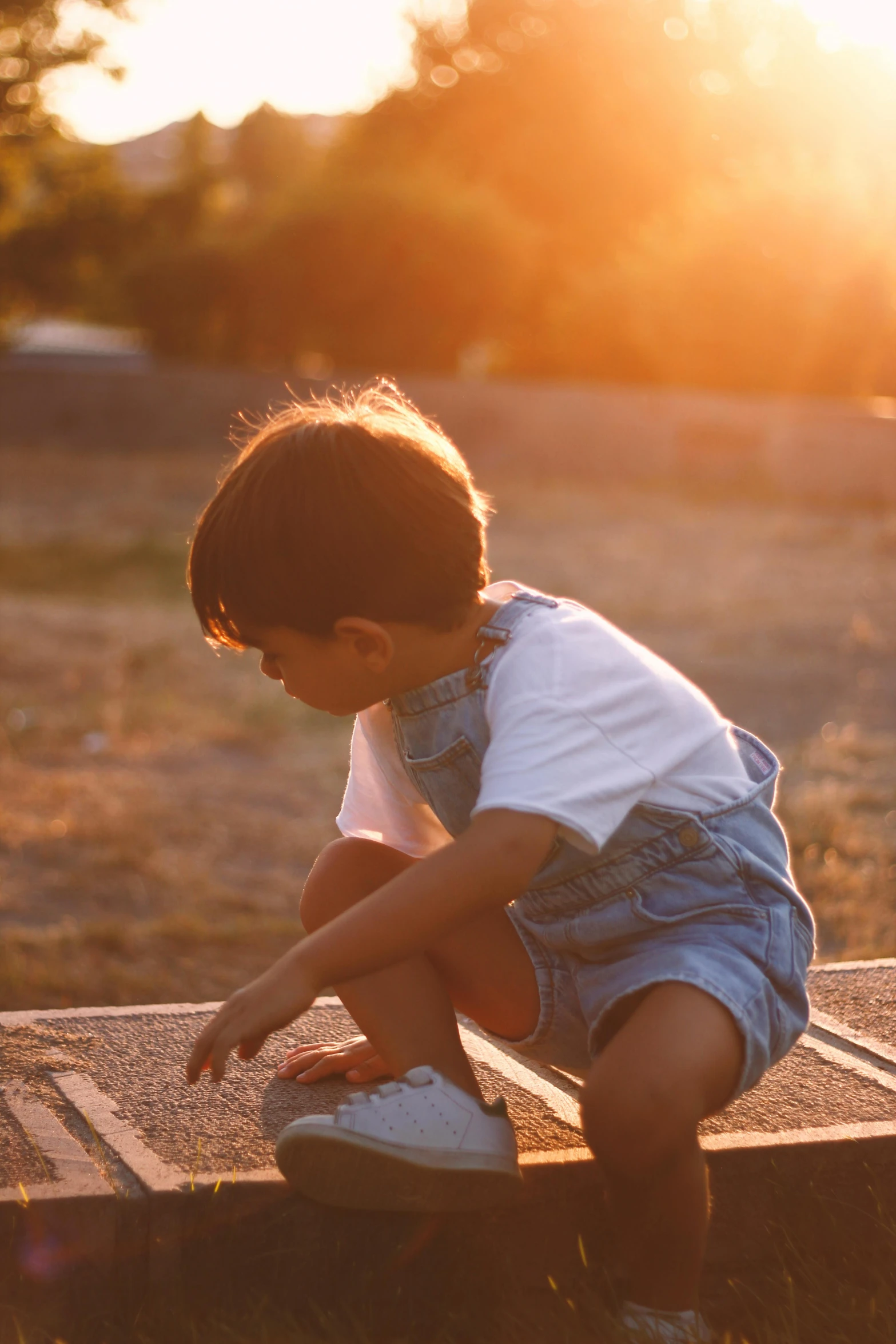 a young child that is on a wooden plank