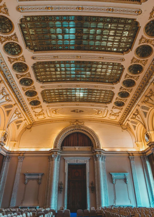 an ornate building with a ceiling that has several wooden panels