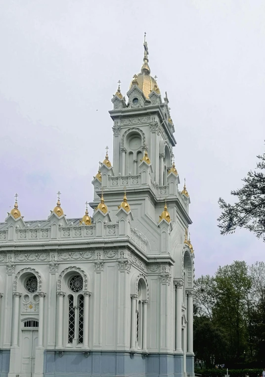 a church with golden steeples and steeple tops