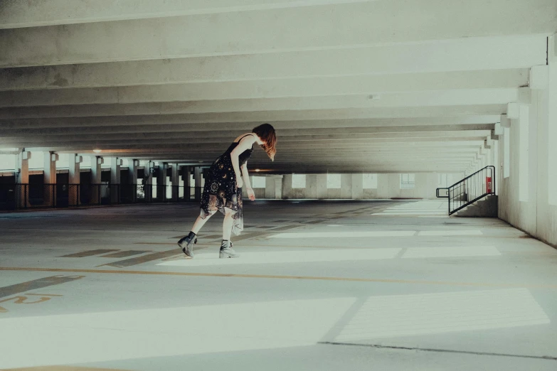 a person with roller skates in an empty room