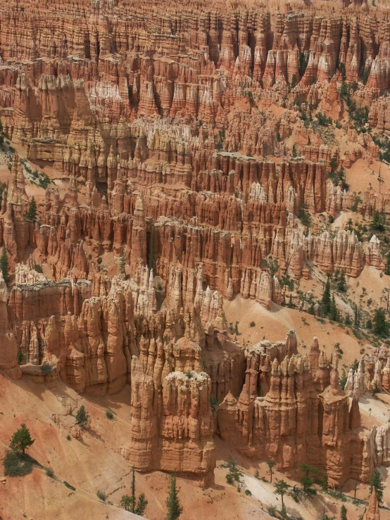 an aerial view of the valley floor near many cliffs