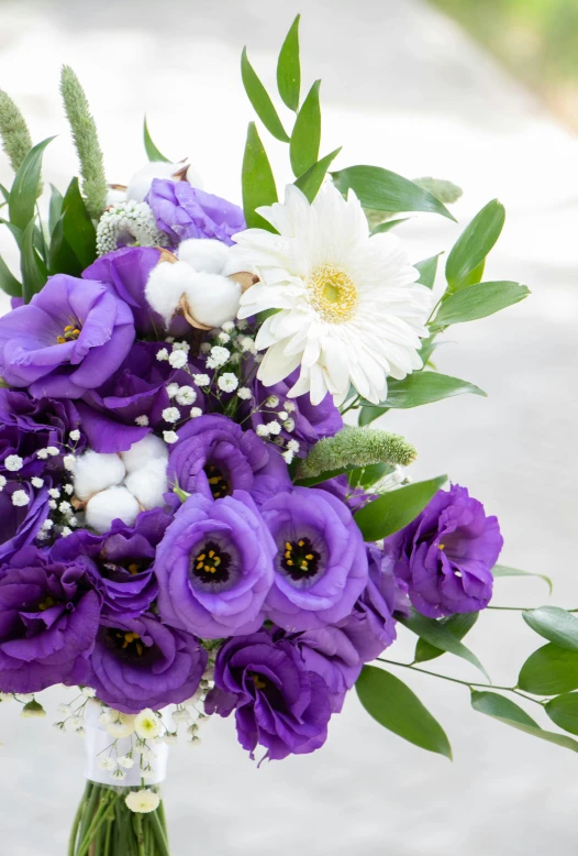 a bouquet of flowers in purple, white and pink flowers