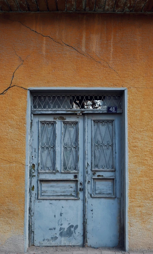 a picture of a door with one window that is slightly open