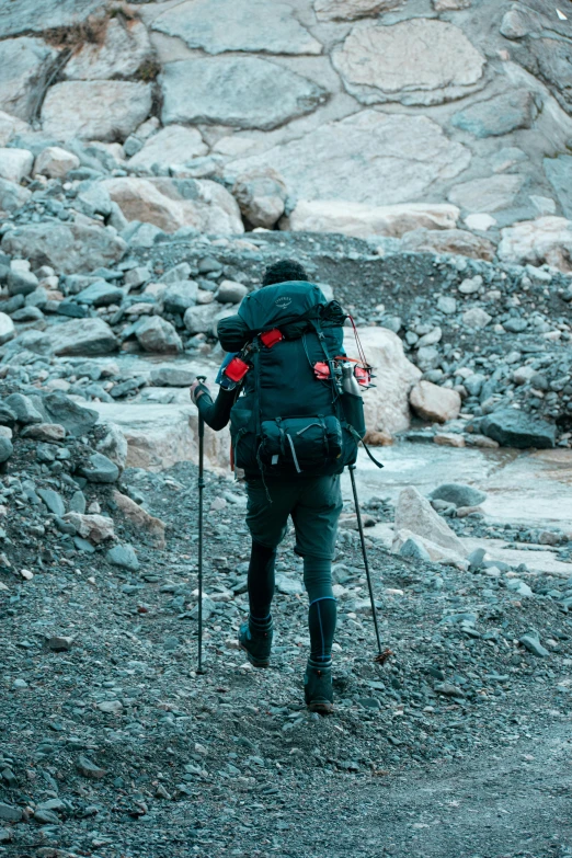 a person on some skis in front of rocks