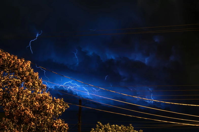 a bunch of lightening above some power lines