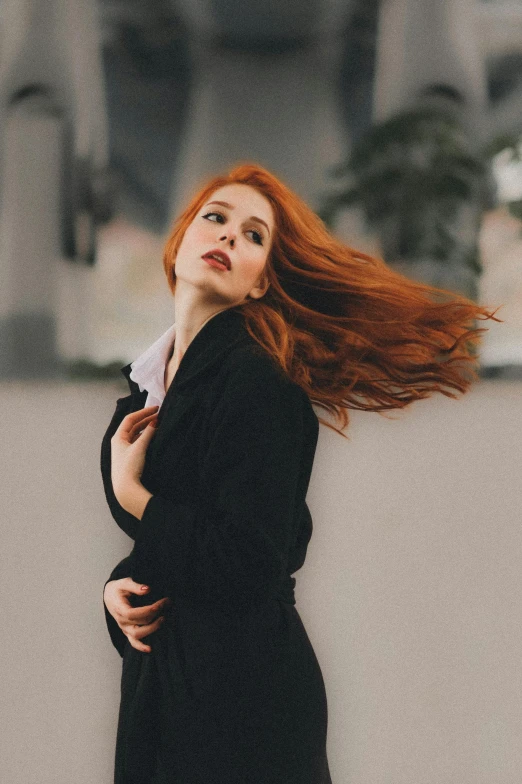 a woman with red hair is looking up