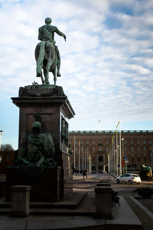 a statue of a man holding a horse