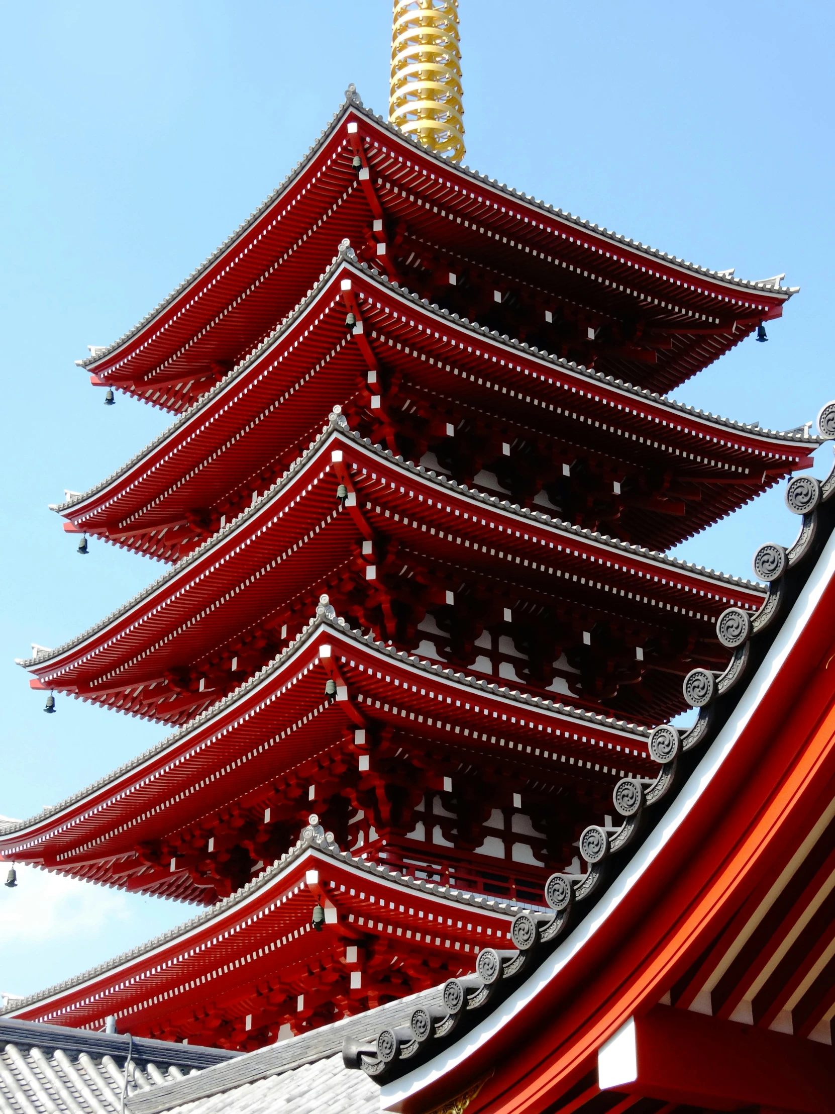 the pagoda tower is covered in many red decorations