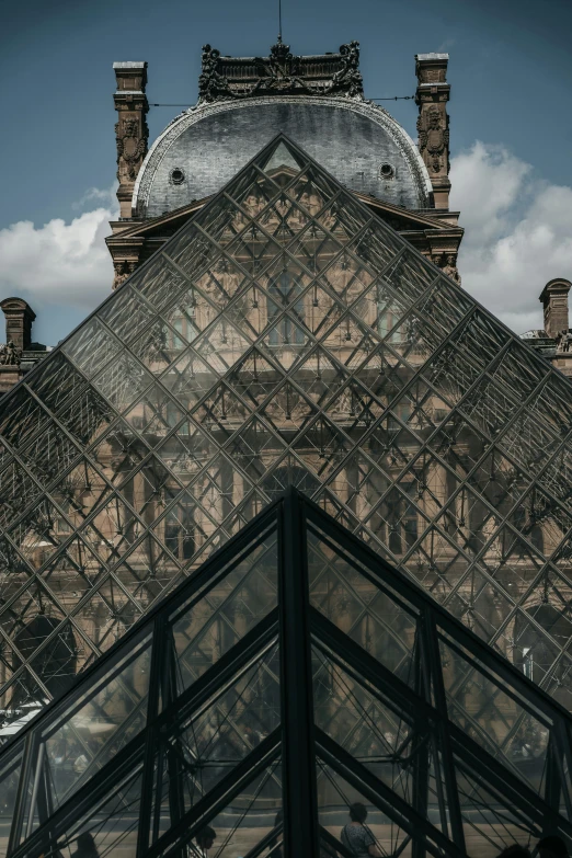 the roof of an old, stone building with a clock on it