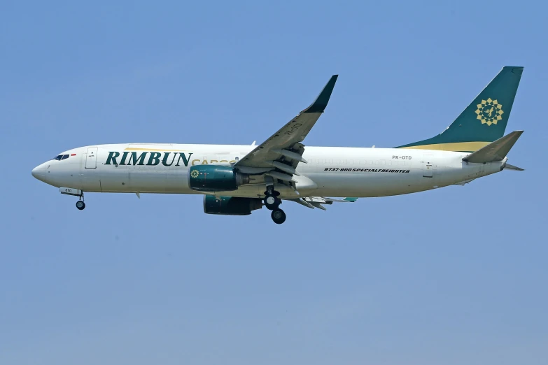 a large airplane flying in the sky during the day