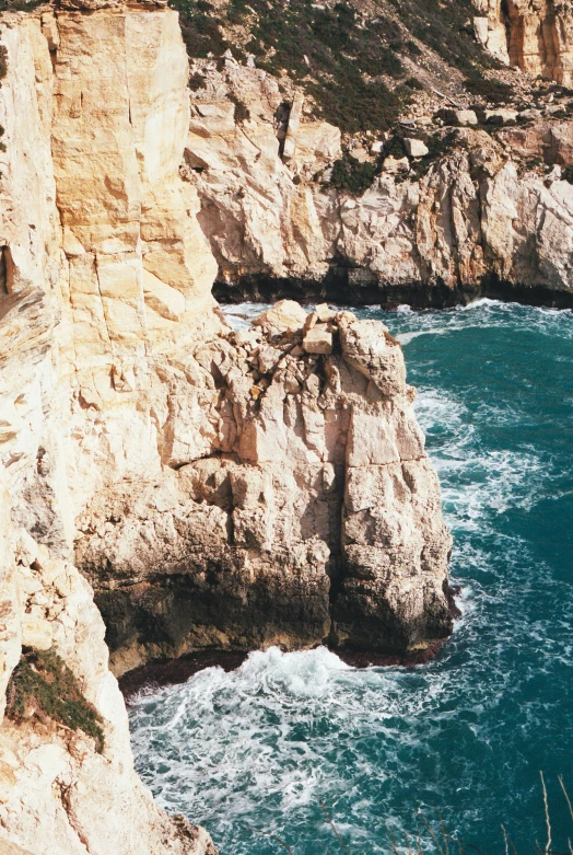 this is an ocean view with rocks around the water