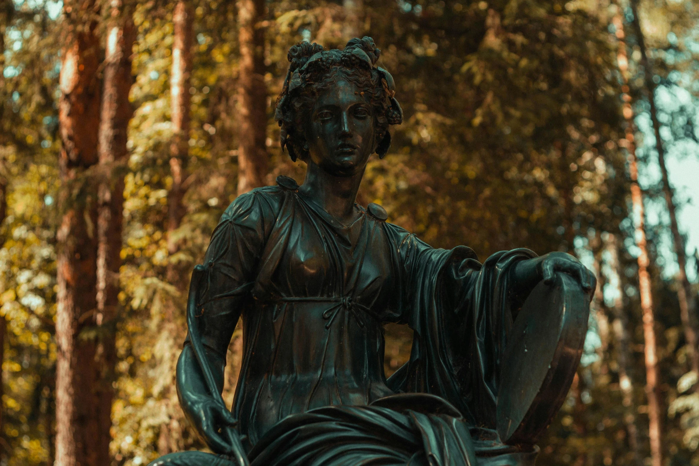 an image of a woman holding a towel near a forest