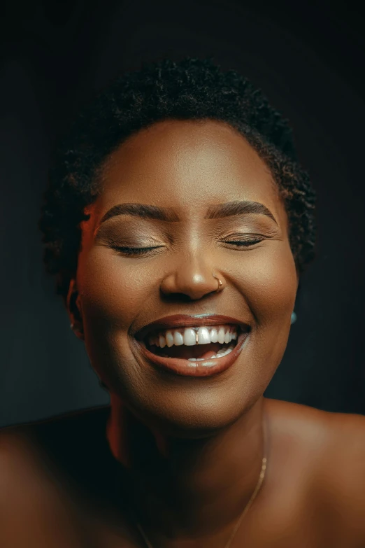 woman with eye shadow smiling for the camera