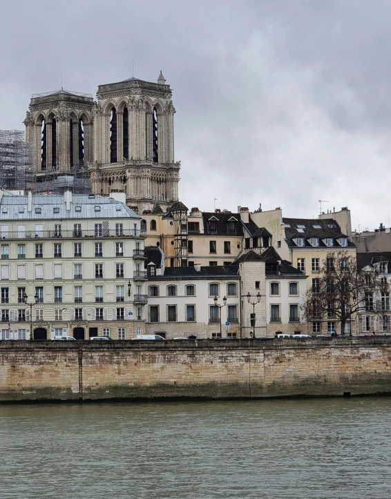 a view of some very pretty buildings next to the water