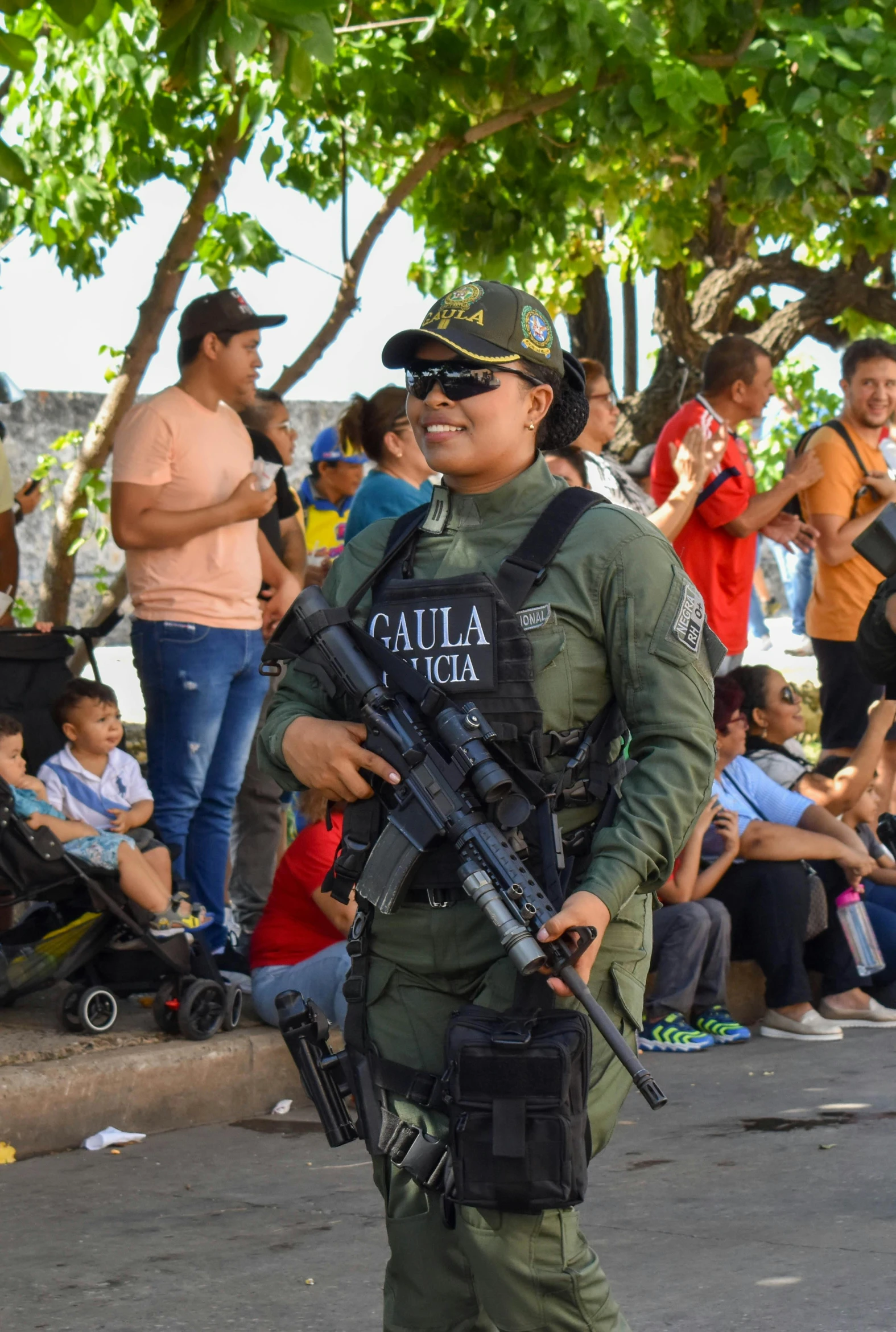 an armed police man with his weapon in hand