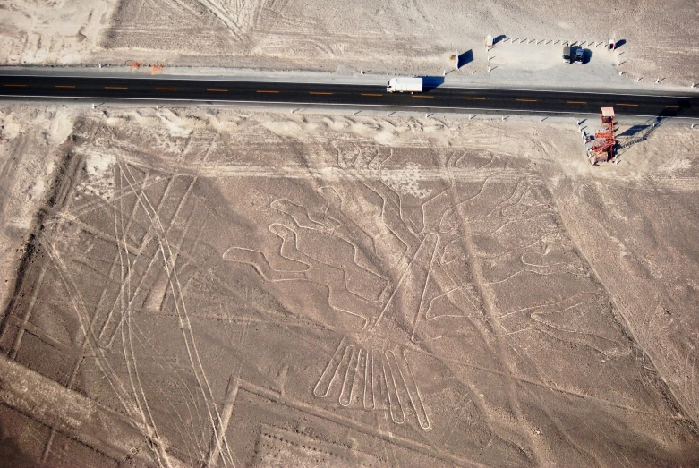 a highway going through a desert with multiple symbols on it