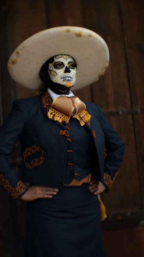 a woman in a costume with a skull mask