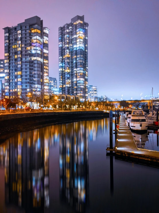 a view of some very tall buildings from the water