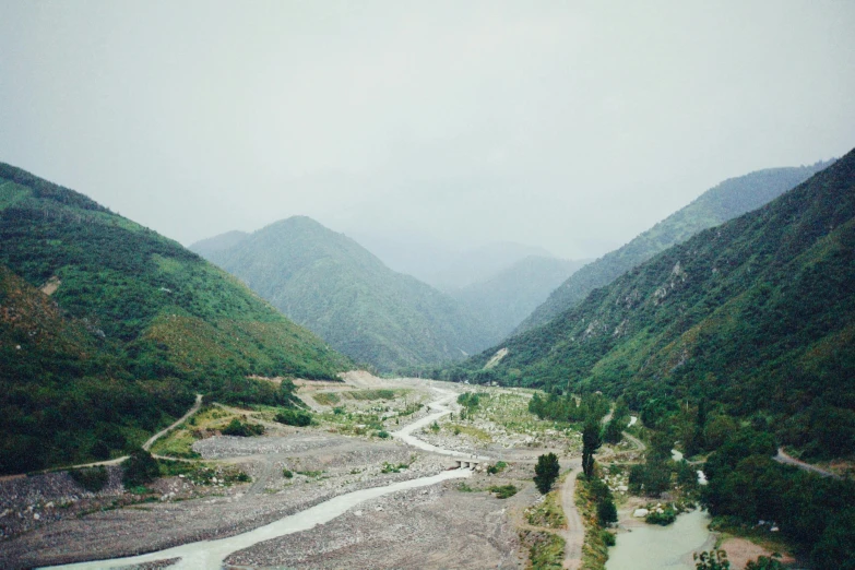 a valley with several hills and a river