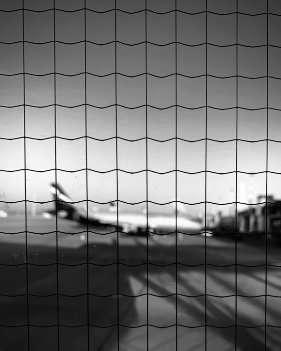 black and white po of a plane at the airport