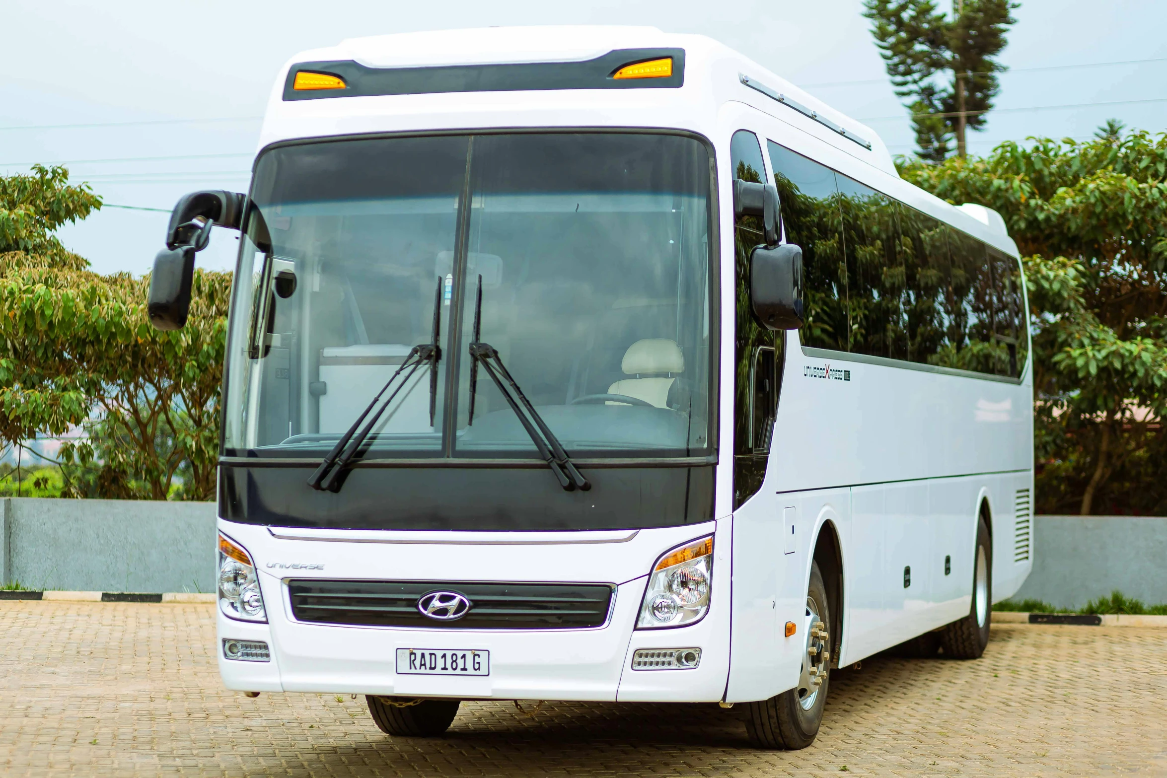 a white bus sitting on top of a street