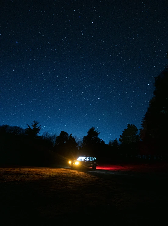 a vehicle is sitting under the night sky