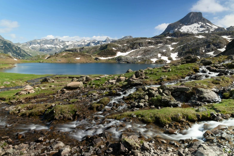 a mountain top covered in snow and water