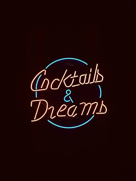 illuminated cocktail sign with the word cocktail & dreams