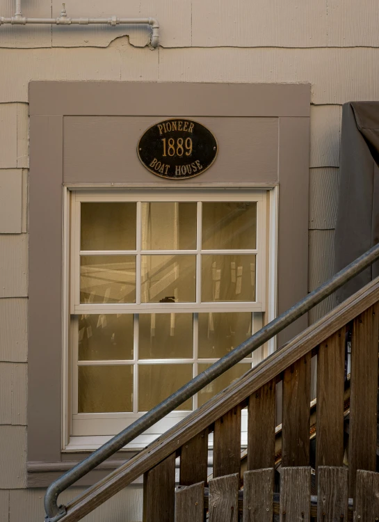 a doorway with an iron railing leading to a window