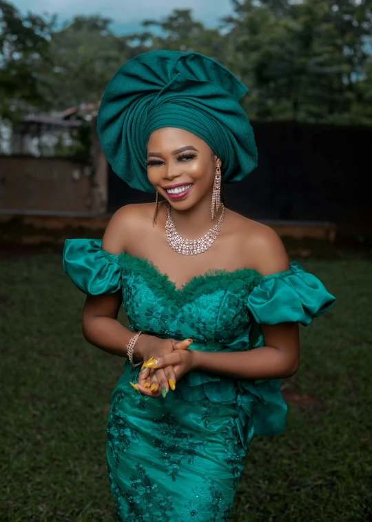 a woman wearing an elegant green dress