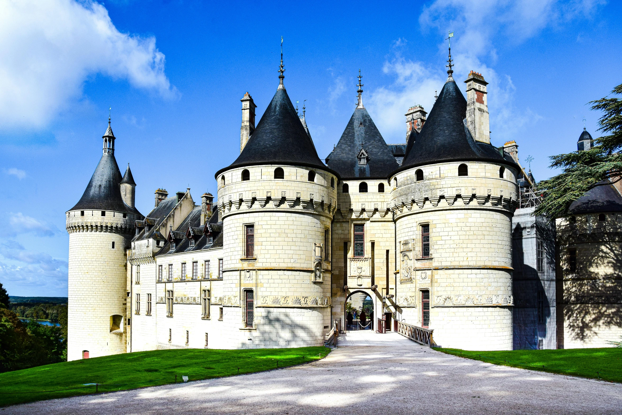 a castle sitting next to an open gate